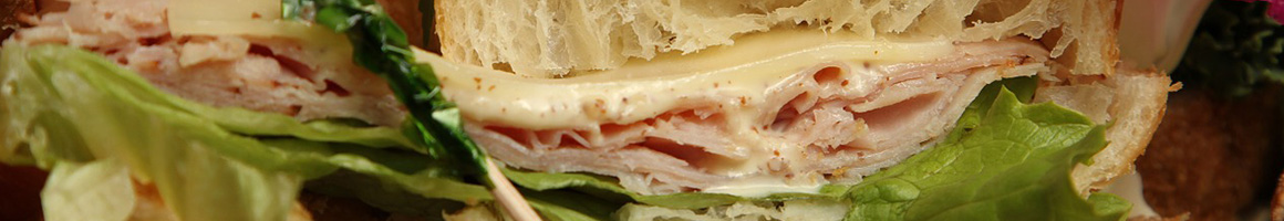 Eating Sandwich at Vashon Island Coffee Roasterie restaurant in Vashon, WA.